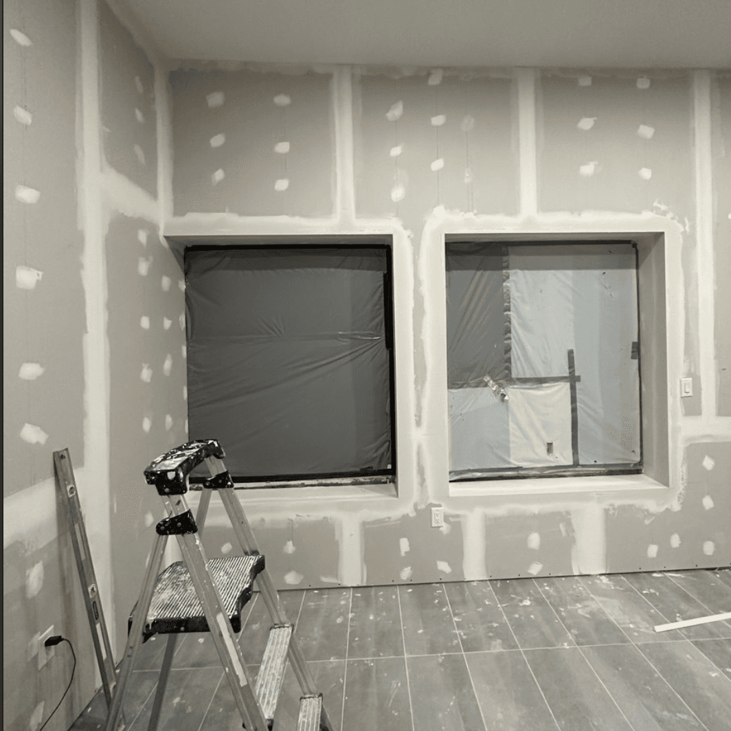 Room with new drywall installed and seams taped
